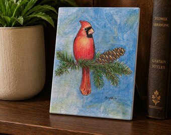 Ceramic Art Tile, Totsuwa, Cardinal on evergreen branch, image sublimated on a decorative, ceramic tile w easel back and tab for hanging.