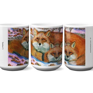 May include: White ceramic coffee mug featuring a watercolor painting of three foxes in a snowy landscape. The foxes have orange fur and are huddled together. The mug has the text "Brothers" and "moonhawkart.com".