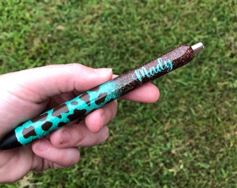 Turquoise/brown cow print pen