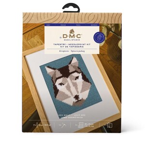 May include: A D.M.C. Quail Studio tapestry needlepoint kit featuring a geometric wolf design. The kit includes materials for a 7.9 x 8.3 inch (20 x 21 cm) finished piece. The packaging is brown with a black handle.