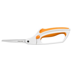 May include: White and orange Fiskars brand shears with a curved blade and a comfortable grip.