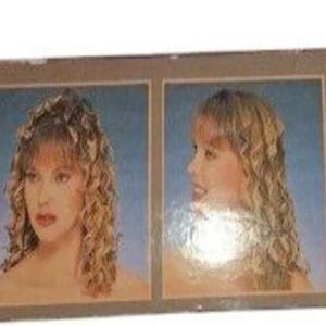 May include: A product box featuring two images of a woman with curly blonde hair. The images show the woman from the front and side, with a blue background. The product appears to be related to hair styling or hair care.