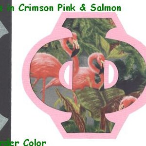May include: Two fabric letters, an "M" and a Greek letter "Phi", in a pink and salmon color scheme. The letters are decorated with a tropical print featuring pink flamingos and green foliage.