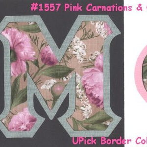 May include: Two fabric letters, "M" and "Phi", with a floral pattern of pink carnations and Queen Anne's Lace. The letters are cut out and have a light gray border. The text "#1557 Pink Carnations & Queen Anne's Lace" is at the top of the image. The text "Upick Border Color" is at the bottom of the image.