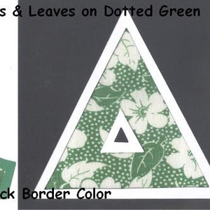 May include: A green and white fabric letter A with a white border. The fabric has a white floral pattern on a green background with white dots. The letter is cut out and ready to be used for a craft project. #1548 White Flowers & Leaves on Dotted Green