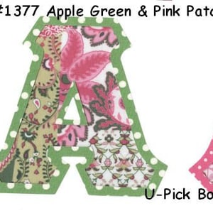 May include: Two felt letter A's with a patchwork design in green and pink. The letters have a white polka dot border. The text #1377 Apple Green & Pink Patchwork is at the top of the image. The text U-Pick Border is at the bottom of the image.