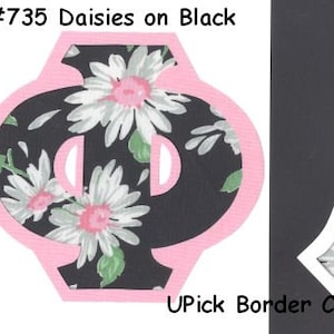 May include: Two letter shapes, a Phi and an A, with a white border and a black background. The shapes are filled with a white daisy pattern on a black background. The text "#735 Daisies on Black" is at the top of the image. The text "UPick Border Color!" is at the bottom of the image.