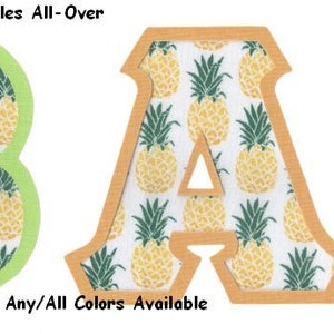 May include: Two wooden letters, "B" and "A", with a pineapple pattern. The letters have a green and orange border, respectively. The text "#1630 Pineapples All-Over" and "U-Pick Border - Any/All Colors Available" is visible below the letters.