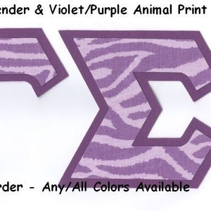 May include: Two purple and white zebra print letters, "R" and "C", with a dark purple border. The text "#189 Lavender & Violet/Purple Animal Print" and "U-Pick Border - Any/All Colors Available" is below the letters.