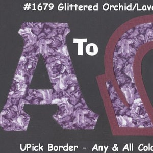May include: A purple and white floral fabric letter A and a purple and white floral fabric letter O with a maroon border. The letters are cut out and the text "To" is written in white above the letters. The text "#1679 Glittered Orchid/Lavender Roses" is written in white at the top of the image. The text "UPick Border - Any & All Colors Available" is written in white at the bottom of the image.