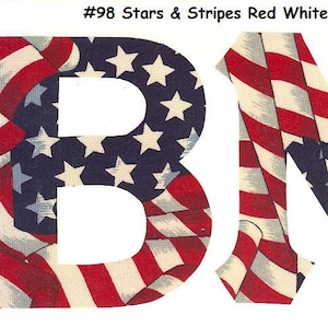 May include: Two large letters, "B" and "M", are cut out of fabric with a stars and stripes pattern in red, white, and blue. The letters are on a white background. #98 Stars & Stripes Red White Blue