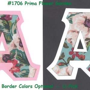 May include: Two pink and white letter A's with a floral pattern. The letter A's are cut out of fabric and have a white border. The text #1706 Prima Flower Garden is at the top of the image. The text Border Colors Optional - U-Pick is at the bottom of the image.
