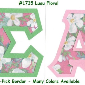 May include: Two letters, a green "Σ" and a pink "A", are cut out of pink fabric with a white floral pattern. The letters are outlined in green and pink, respectively. The text "#1735 Luau Floral" is above the letters, and the text "U-Pick Border - Many Colors Available" is below the letters.
