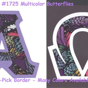 May include: Two iron-on patches with a multicolor butterfly design. The patches are shaped like the letters A and Omega. The text #1725 Multicolor Butterflies and U-Pick Border - Many Colors Available is visible in the image.