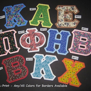 May include: Ten fabric letters in various colors and patterns, including K, A, E, Π, Φ, Η, Β, and X. Each letter has a white border. The letters are arranged in two rows. The text "Pic-A-Print - Any/All Colors for Borders Available" is at the bottom of the image.