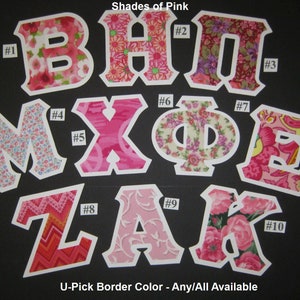 Puede incluir: Diez letras de tela en varios tonos de rosa, cada una con un patrón floral diferente. Las letras deletrean "BHP MXFE ZAK". Cada letra está numerada del 1 al 10. Las letras están sobre un fondo negro. El texto "Shades of Pink" y "U-Pick Border Color - Any/All Available" también es visible.