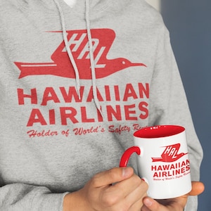Get Your Aloha Fix with our Retro Hawaiian Airlines Hoodie. Hoody Has The Iconic, Island-Inspired Logo on-Perfect Jumper for Everyday Use!