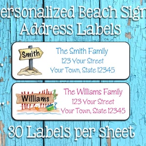 May include: Two personalized beach address labels with a blue and white wooden background. The first label features a beach scene with a sign that says "Smith" and the text "The Smith Family, 123 Your Street, Your Town, State 12345". The second label features a beach scene with a sign that says "Williams" and the text "The Williams Family, 123 Your Street, Your Town, State 12345". The text "30 Labels per sheet" is at the bottom of the image.