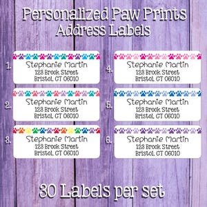 May include: Thirty personalized address labels with paw prints in various colors. The labels feature the name "Stephanie Martin" and the address "123 Brook Street, Bristol, CT 06010".