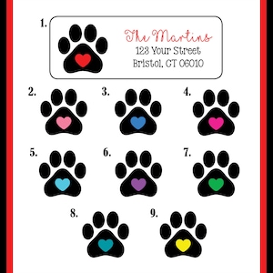 May include: Nine paw print stickers with different colored hearts in the center. The paw prints are black and the hearts are red, pink, blue, purple, green, turquoise, and yellow. The stickers are numbered 1 through 9.