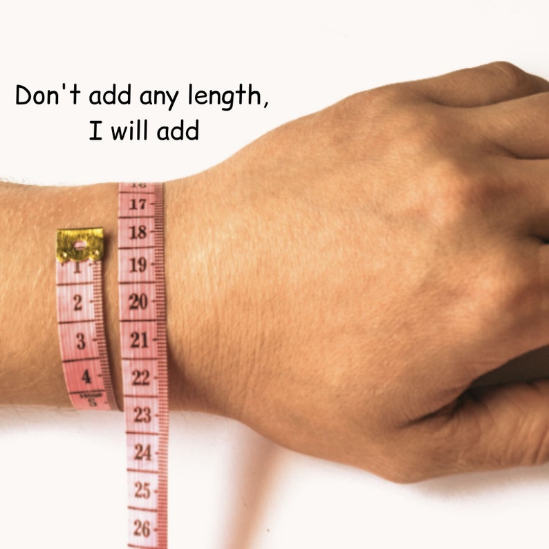 May include: A pink measuring tape is wrapped around a person's wrist. The tape reads "Don't add any length, I will add" and shows measurements from 17 to 26 inches.