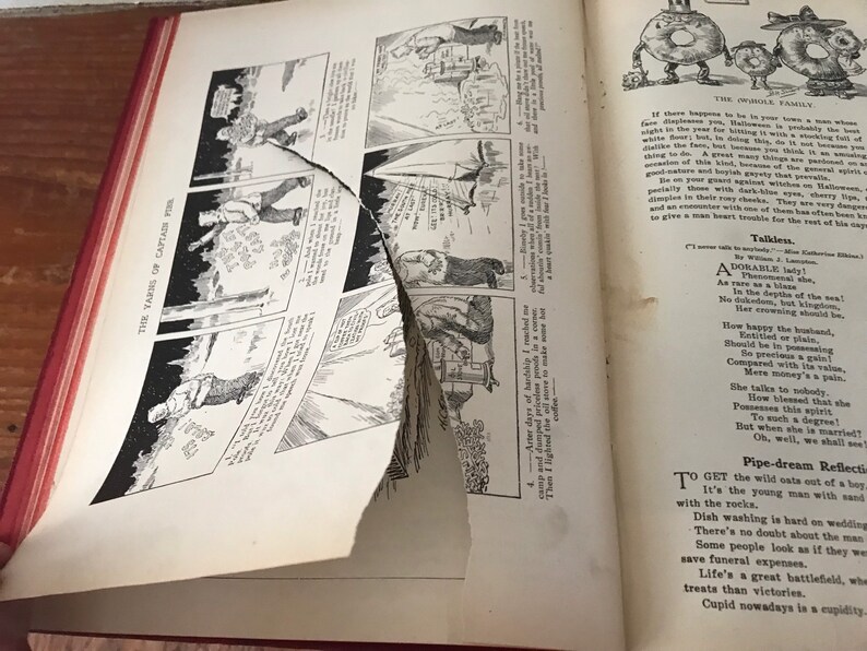 May include: A vintage book with a torn page, showing a black and white comic strip illustration of a man in a forest. The text on the page reads "The Yarns of Captain Pipe". The opposite page shows a black and white illustration of two cartoon characters with the text "The Owollo Family".
