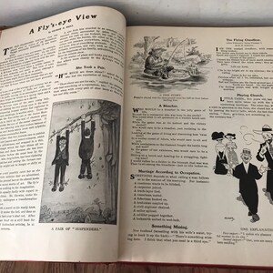 May include: A vintage book with black and white illustrations and text. The book is open to a page with the title "A Fly's-eye View" and several short stories and illustrations. The text includes the phrases "She Took a Pair", "A Pair of Suspenders", "A Bleacher", "The Flying Chauffeur", "Playing Church", "Something Missing", and "One Explanation".