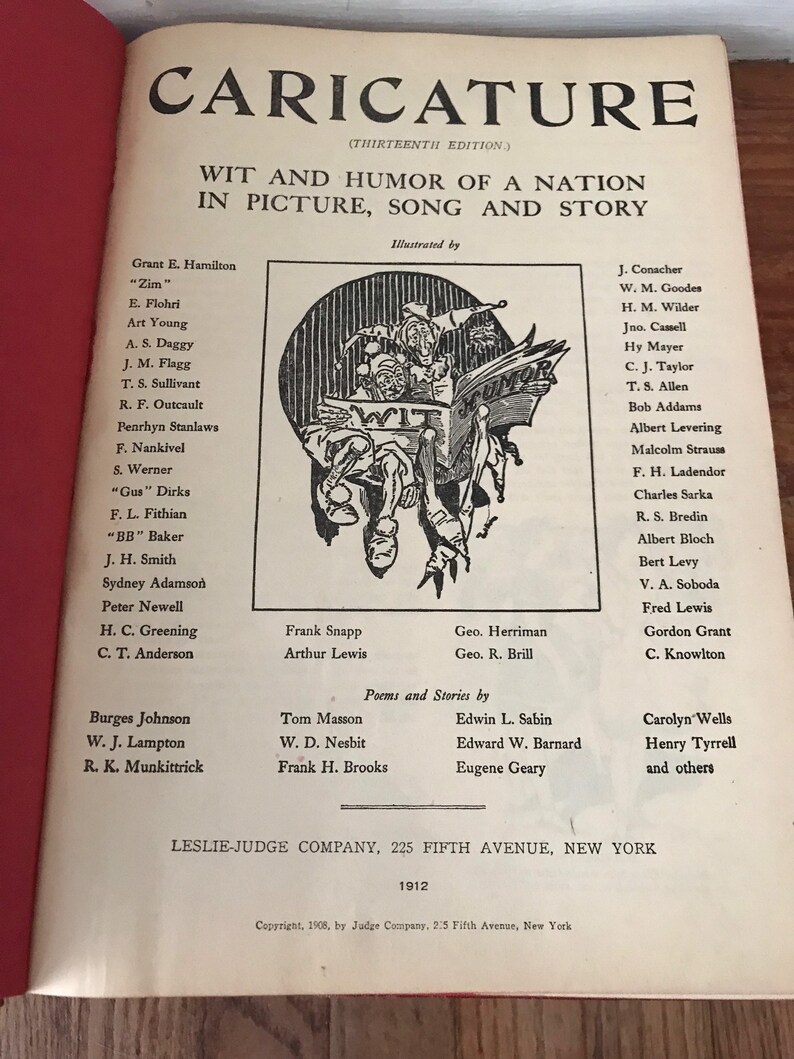 May include: A black and white illustration of a jester holding a book that says "Wit" on one side and "Humor" on the other. The illustration is from a book titled "Caricature: Wit and Humor of a Nation in Picture, Song and Story".