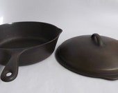 Unmarked Wagner deep skillet CF w matching lid. Unique quot small hole quot handle. Segmented drip basting rings. Exceptional condition. Rare.