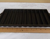 Unmarked 11-slot bread stick pan. ERIE PA USA. Excellent Condition. Pre- 1960 manufacture.