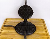 Antique Griswold Slant Logo American No 7 Waffle Iron 889. 890 w low base 972, Pat 39 d Dec 1 1908. Erie PA USA. Excellent restored condition.