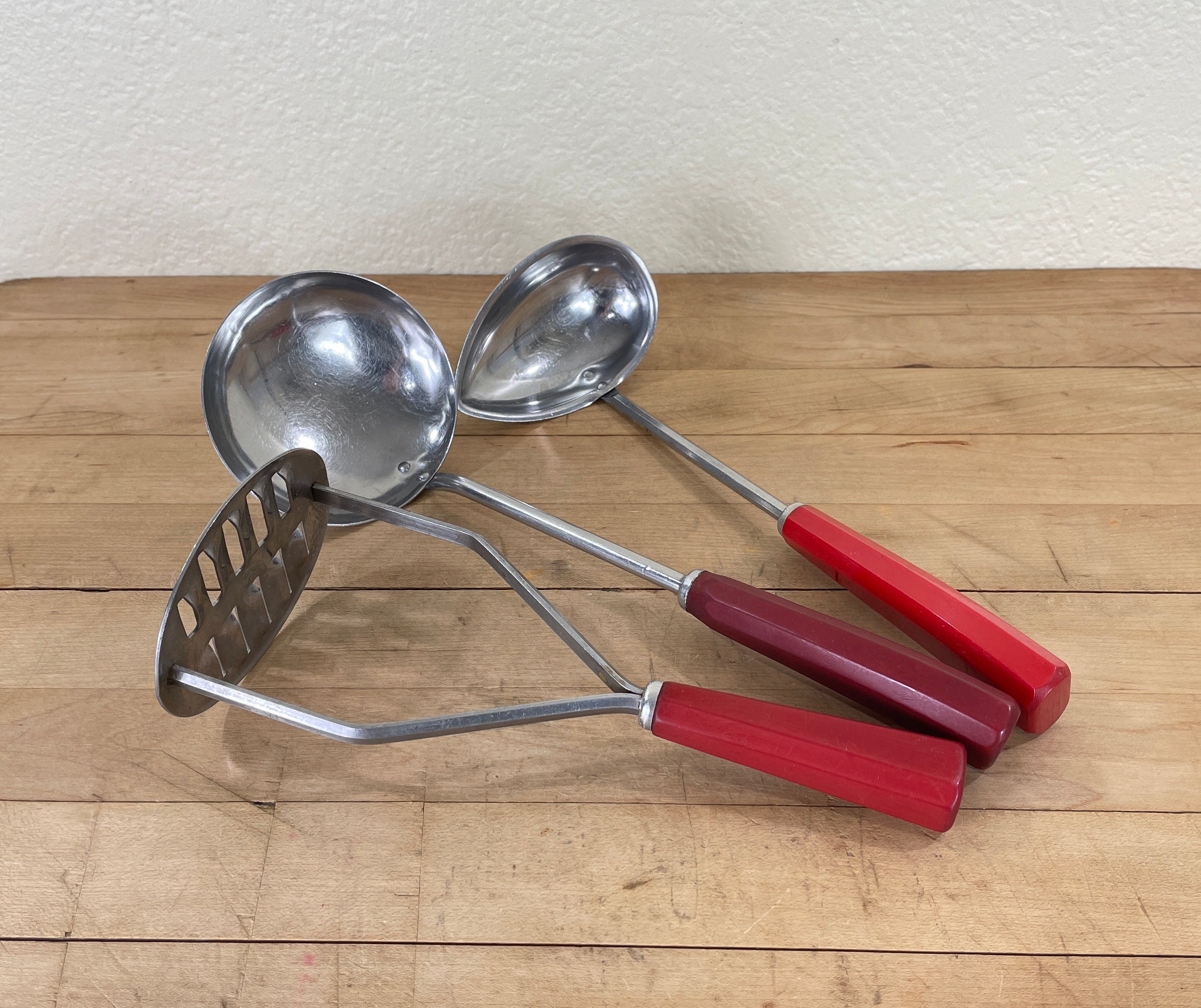 Kitchen Utensils by Corona, 2 Ladles soup and Canning and a Masher,  Stainless Steel Red Catalin Bakelite Handles Set of 3, All Included 