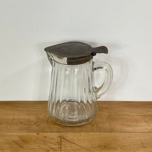 Antique Syrup Pitcher by Anchor Hocking, Clear Ribbed Pressed Glass Syrup Pitcher with Tin Thumb Press Open and Slide On / Off Lid