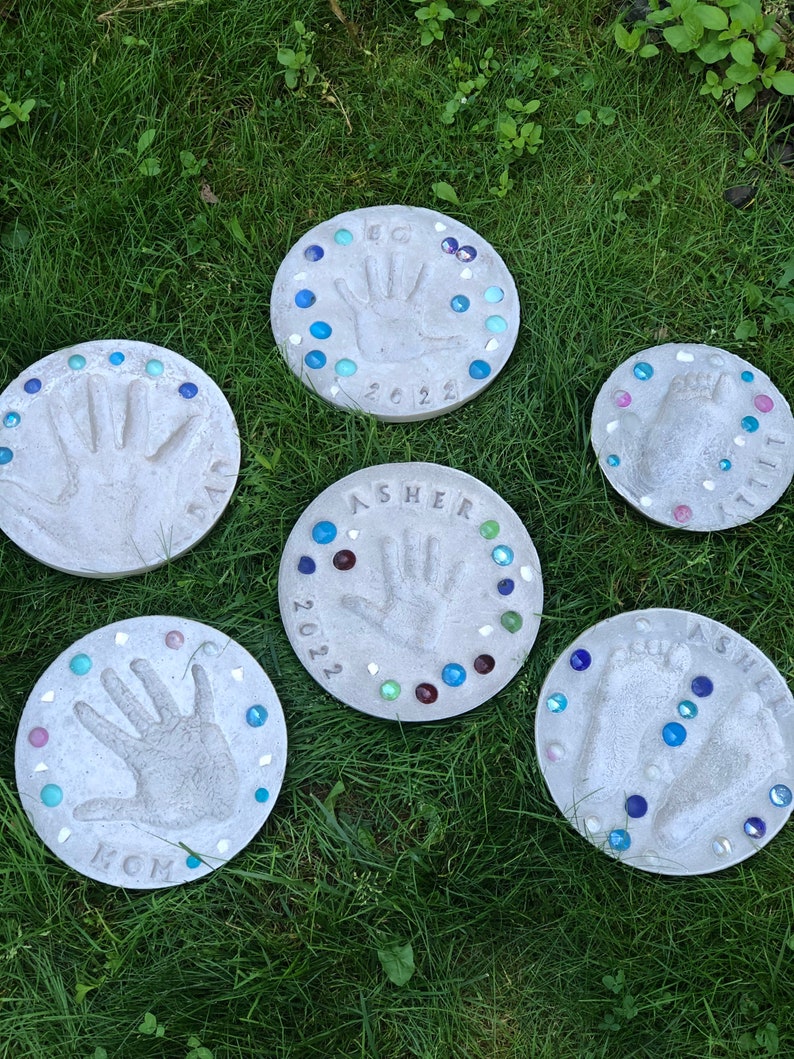 Do It Yourself family hand and foot print stepping stones. DIY family stepping stone kits.