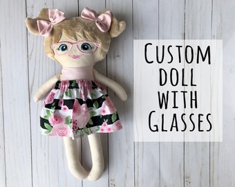 soft doll with glasses