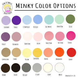May include: Color chart showing 24 minky fabric colors.  The colors are arranged in four rows of six colors each.  The colors are: Lavender, Purple, Light Baby Blue, Sky Blue, Salt Water, Honey Dew, Olive, Violet, Rosewater, Baby Pink, Blush, Paris Pink, Hot Pink, Fuchsia, Cappuccino, Camel, Yellow, Sunshine, Papaya, Mandarin, Cherry, Brown, Black, Dark Gray, Light Gray, Ivory, White.  Updated 10-4-20.