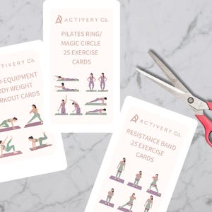 May include: Three exercise card sets with illustrations of workout moves. The cards are labeled "25 No-Equipment Body Weight Workout Cards", "Pilates Ring/Magic Circle 25 Exercise Cards", and "Resistance Band 25 Exercise Cards". A pair of scissors with red handles is also in the image.