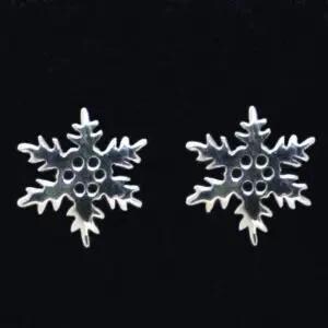 May include: A pair of silver snowflake stud earrings. Each earring has a detailed snowflake design with six points and small circular cutouts. The earrings are set against a black background.