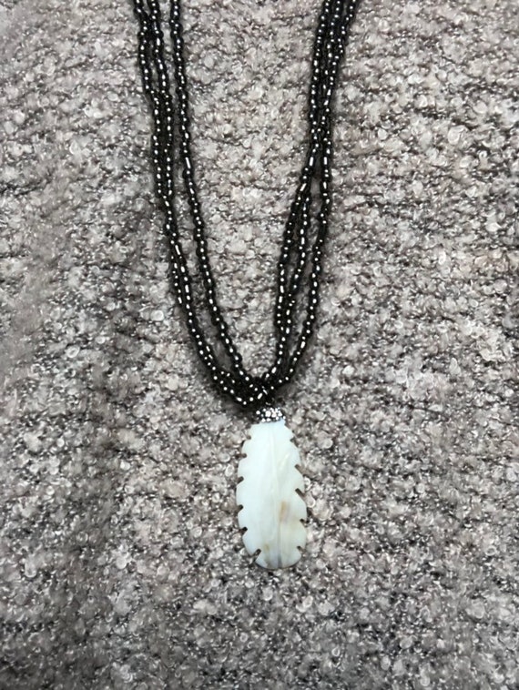 Neclace made of cow horn and mother of pearl