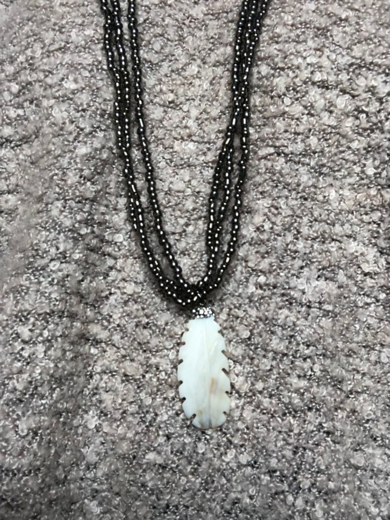 Neclace made of cow horn and mother of pearl