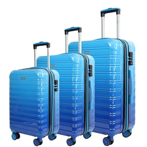 May include: Set of three blue hard-shell suitcases with black accents and wheels. The suitcases are arranged in size order from smallest to largest.