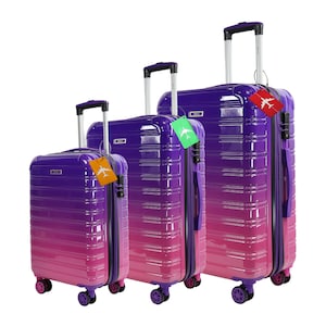 May include: Set of three purple and pink gradient hard-shell suitcases with black handles and wheels. The suitcases have a luggage tag with a plane icon on each.