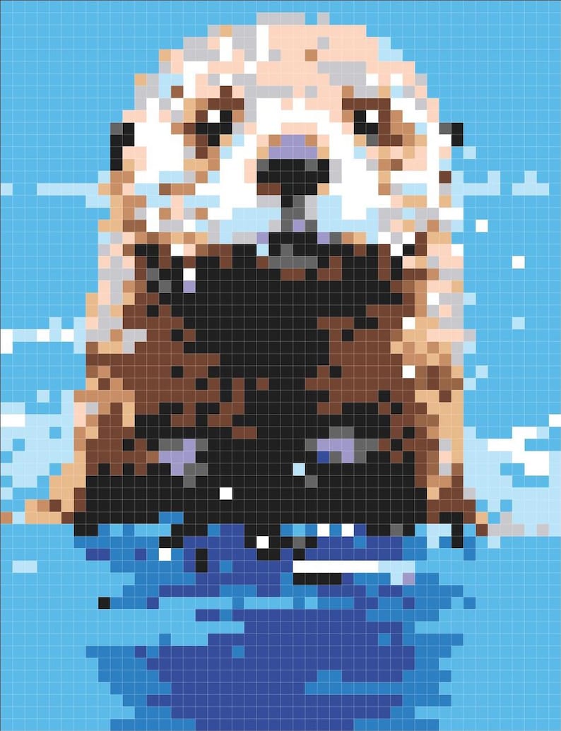 May include: A close-up of a brown and white otter with a black nose and eyes, swimming in blue water. The otter is looking directly at the camera.
