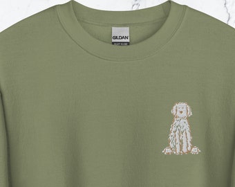 May include: A light green sweatshirt with a small embroidered image of a white dog on the left chest.