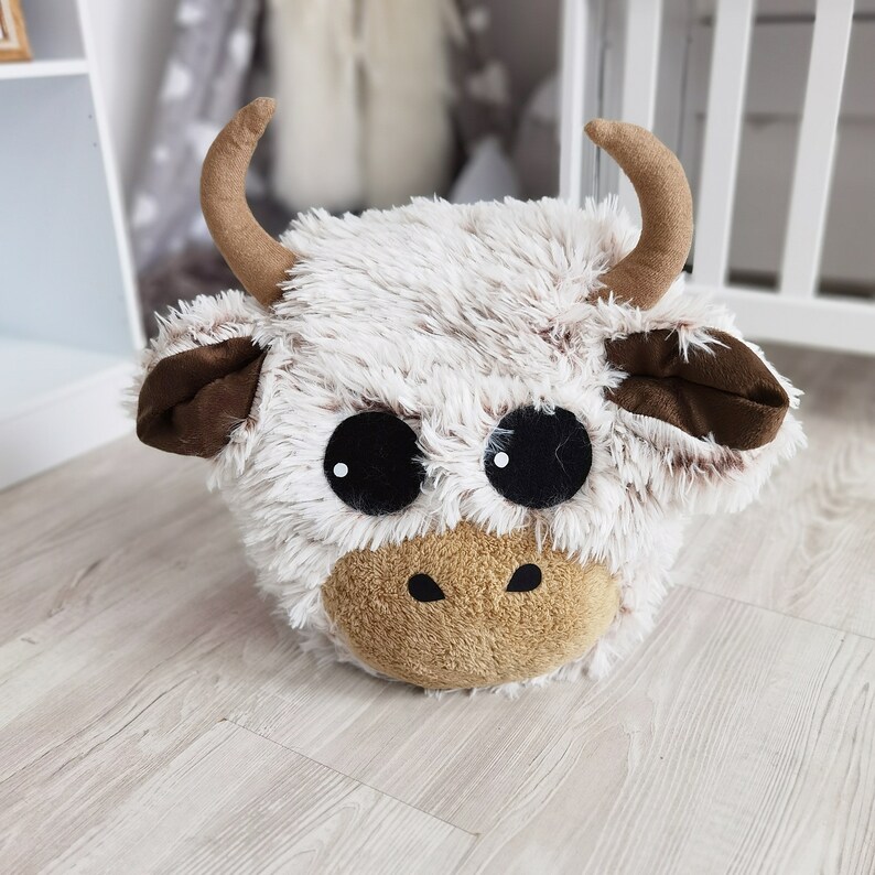 Options for Highland cow pillow: solo or in combo with small to extra-large rugs. Additional choices include basket, lovey, and wall head.