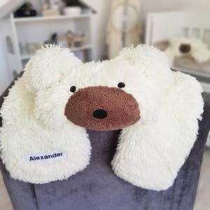 a stuffed bear with a name on it