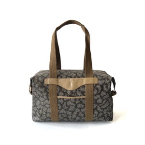 Yves Saint Laurent Bolsa de viagem média autêntica vintage em lona de PVC com padrão girafa
