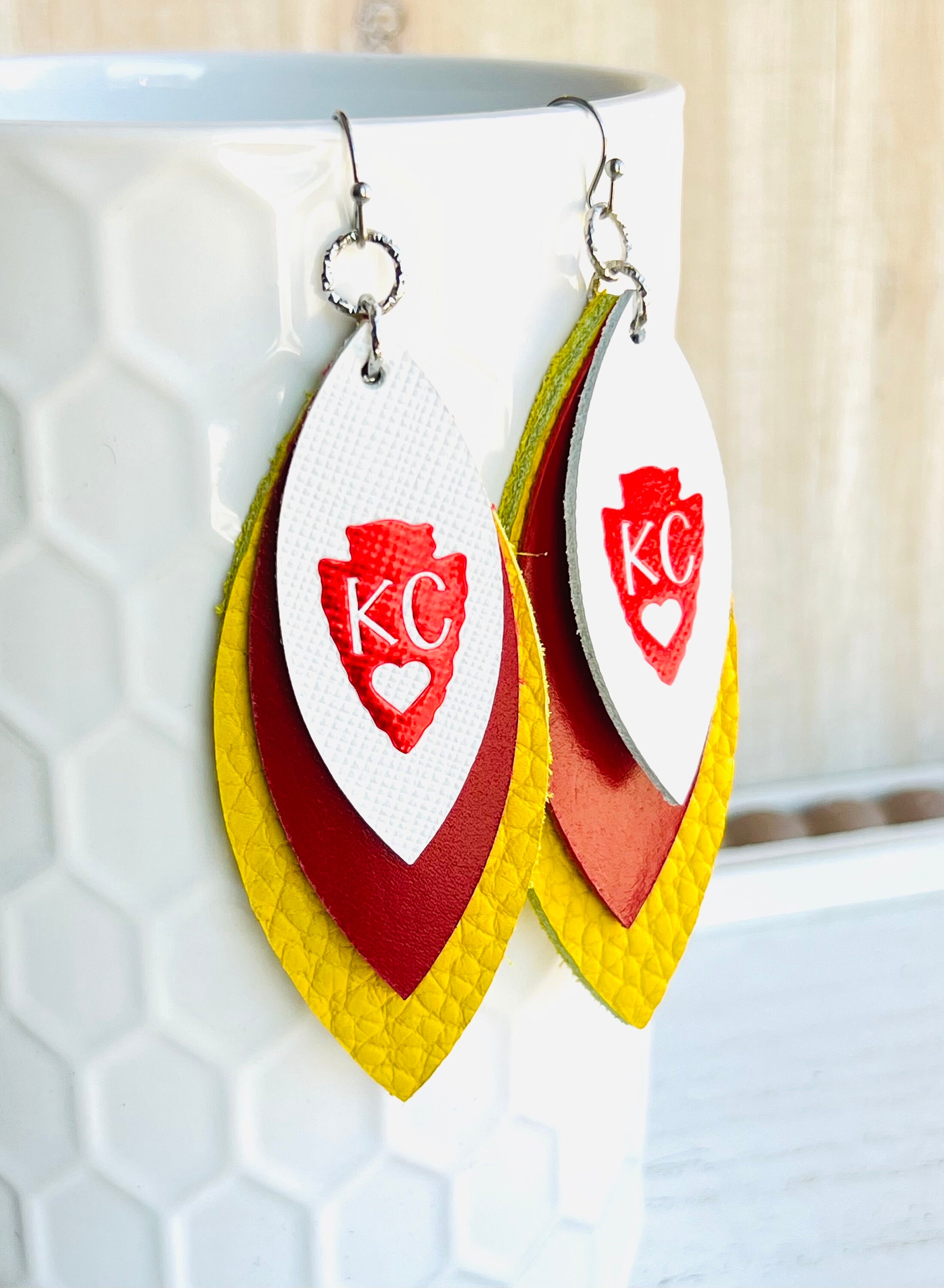 Chiefs leather earrings discount