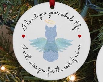 May include: Two round ceramic ornaments with red ribbon hangers. The first ornament features a blue watercolor cat with angel wings and the text "I loved you your whole life. I will miss you for the rest of mine." The second ornament features a black cat with the text "Misty".