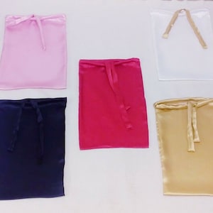 May include: Ten satin drawstring bags in various colours, including white, pink, red, gold, blue, and black.